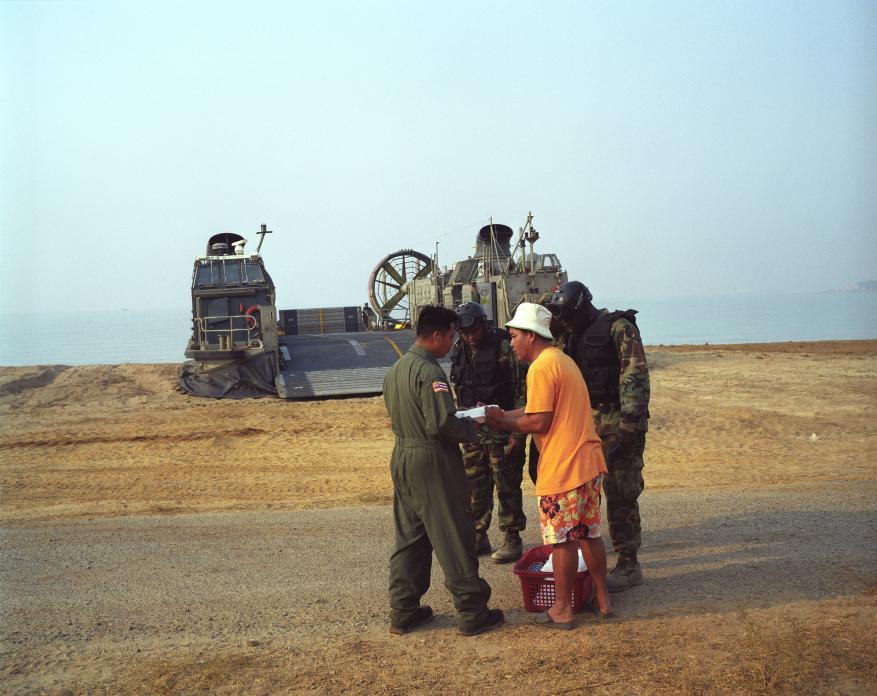 Thai beach vendor and US Marines during 'Cobra Gold' military  exercises, Thailand. 2008