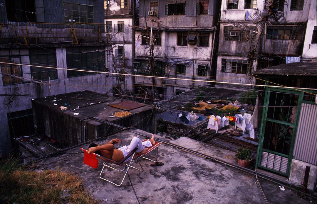 Relaxing on Walled City rooftop, 1989